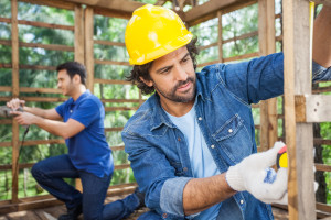 Male Carpenters Working At Construction Site